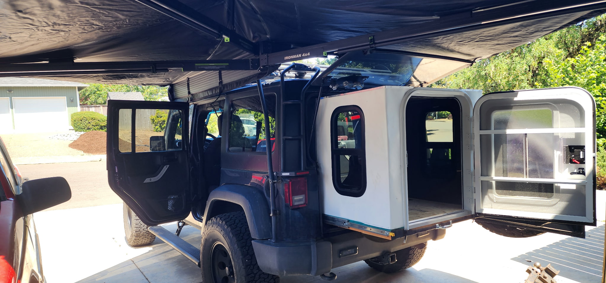 BakPak fully deployed with awning open in driveway